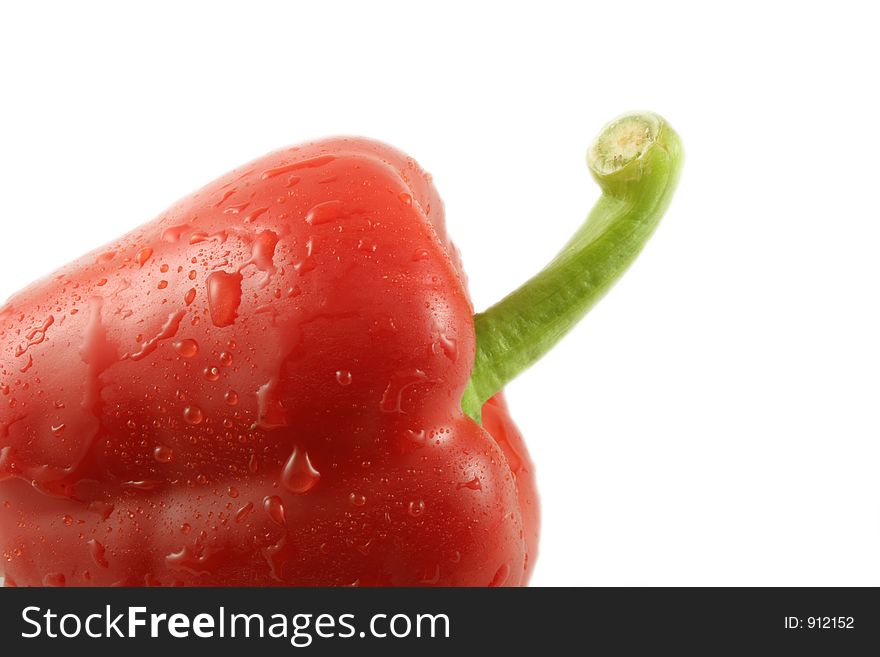 A single red pepper isolated against a white background. A single red pepper isolated against a white background