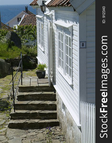 Houses in Loshavn near Farsund in Vest-Agder on the Norwegian south coast. Houses in Loshavn near Farsund in Vest-Agder on the Norwegian south coast.