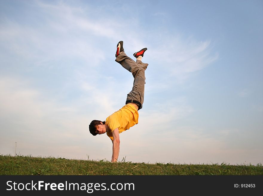 Boy on hands on meadow 4