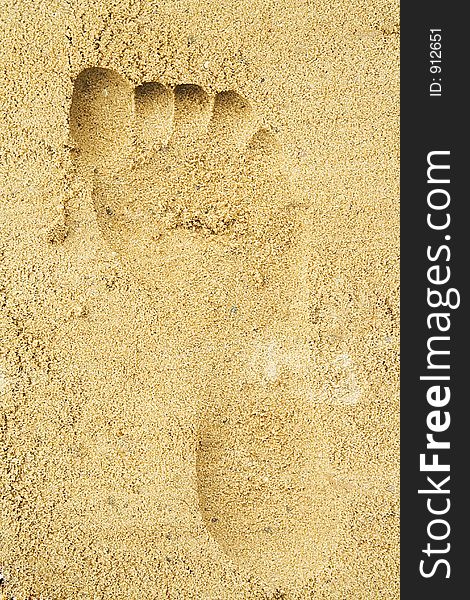 Trace Of A Female Foot On Sand