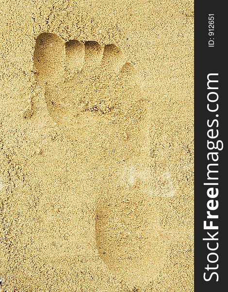 Trace of a female foot on sand