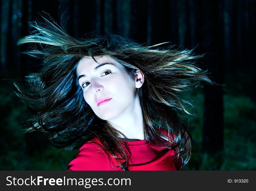 Woman shaking is hair (white balance ajusted in ps)