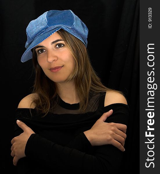 Beautiful woman portrait with a blue hat