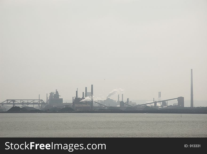 Steel factory pollution over lake