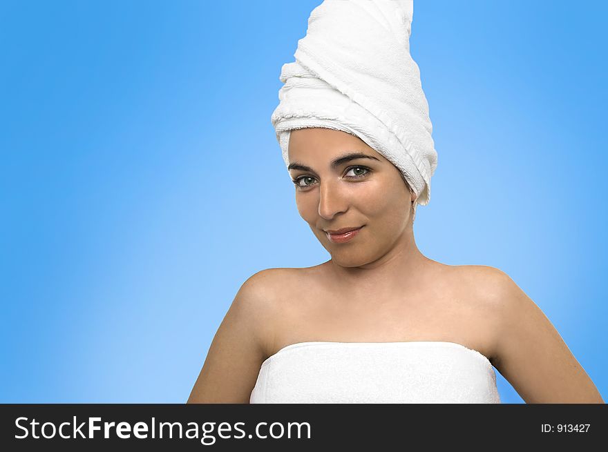 Beautiful woman after the bath in a blue background
