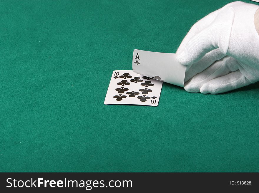Cards in a black jack game, player checking his hand. Cards in a black jack game, player checking his hand