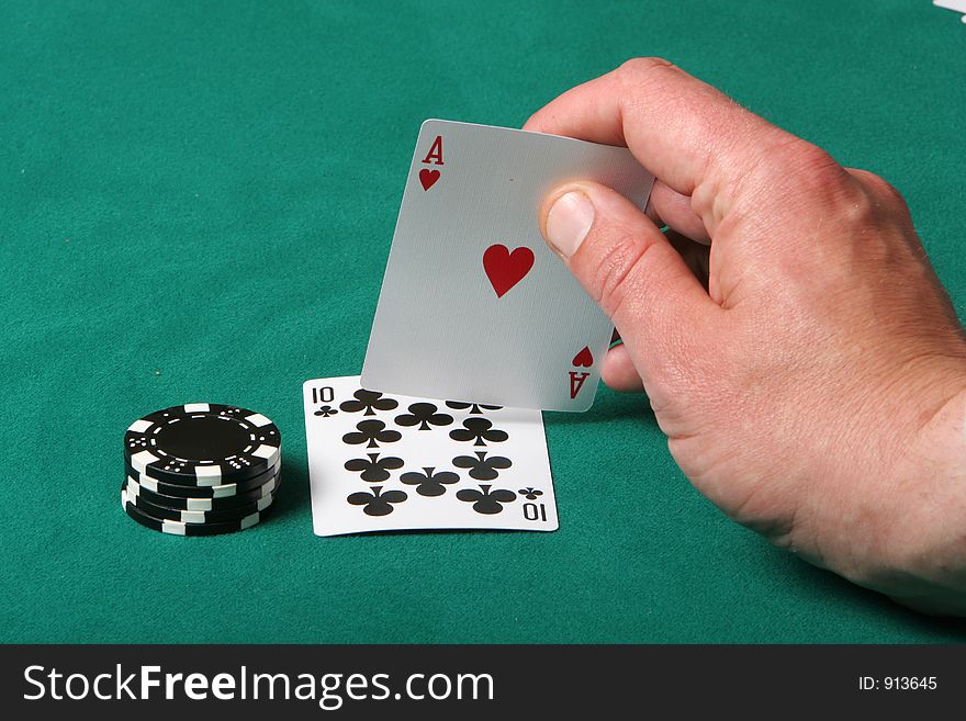 Cards in a black jack game, player checking his hand, getting a fantastic card. Cards in a black jack game, player checking his hand, getting a fantastic card