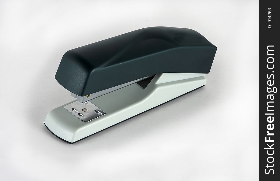 Black stapler on white background