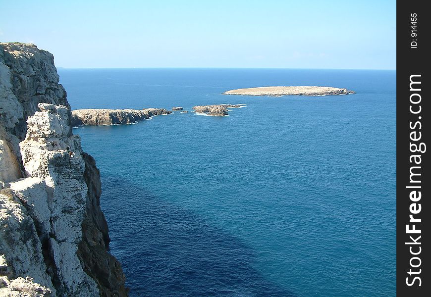 Looking out to sea from the top of a rocky cliff. Looking out to sea from the top of a rocky cliff