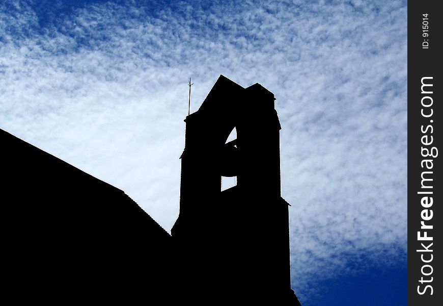 Silhouette of a church bell tower