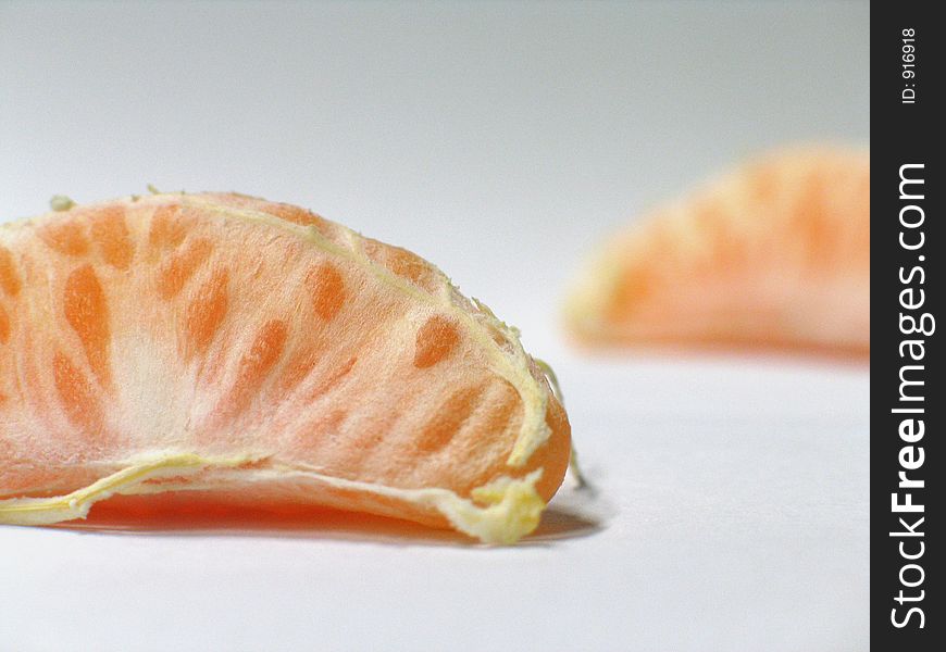 Two peeled mandarines on neutral background. Two peeled mandarines on neutral background