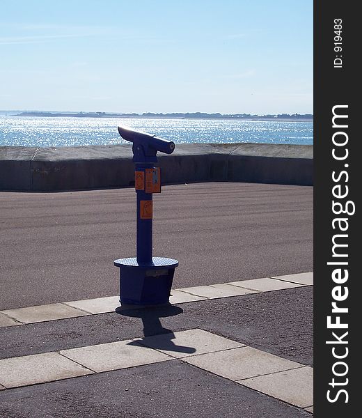 Telescope overlooking the ocean on a sunny day