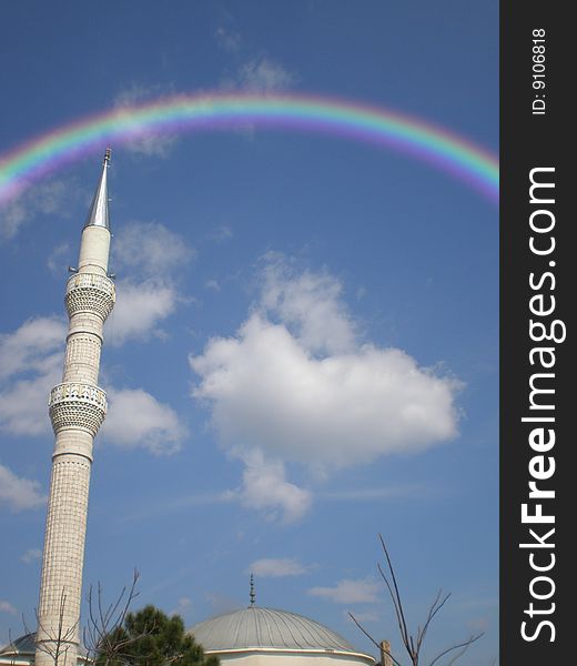 Mosque on a sky background with a rainbow