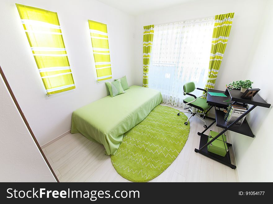 Interior of apartment bedroom decorated in green.