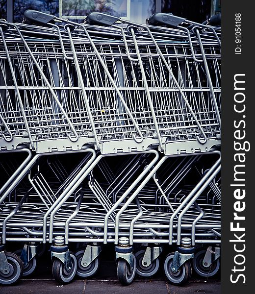 Close up of metal shopping carts.