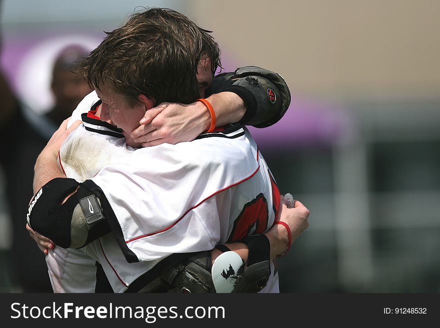 Sports Players Hugging