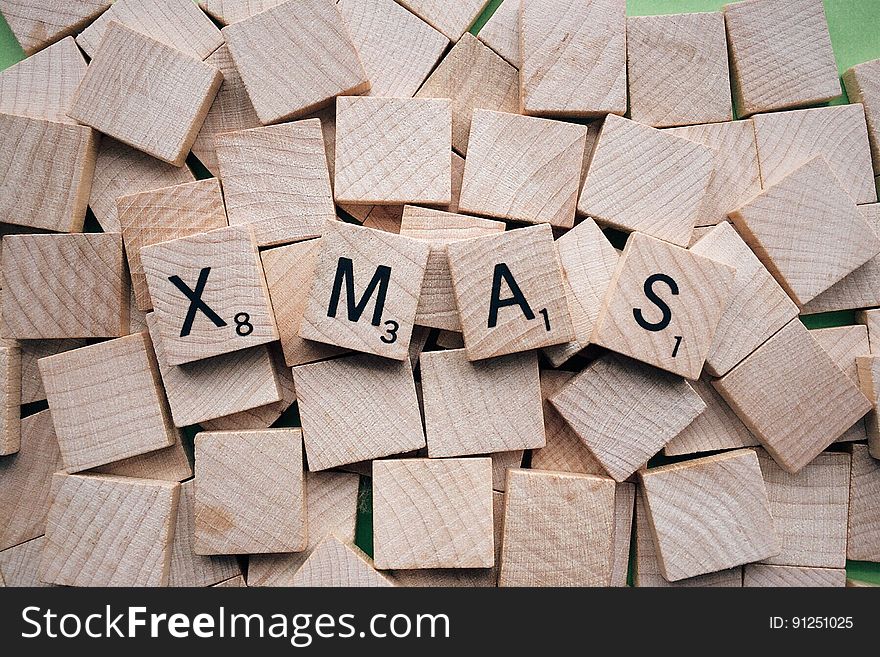 Background of wooden tiles spelling Xmas.
