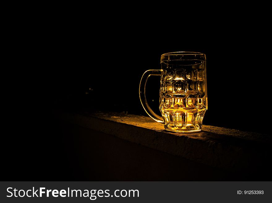 Clear Glass Mug With Beverage during Night Time