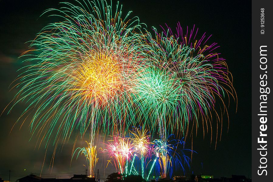 Colorful fireworks burst in night sky. Colorful fireworks burst in night sky.