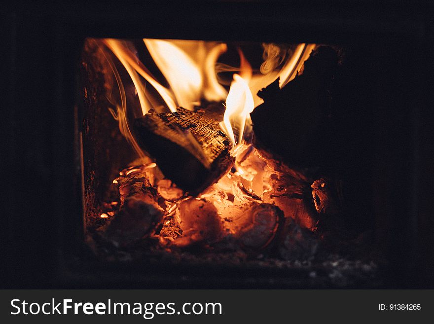 Logs burning in home fireplace. Logs burning in home fireplace.