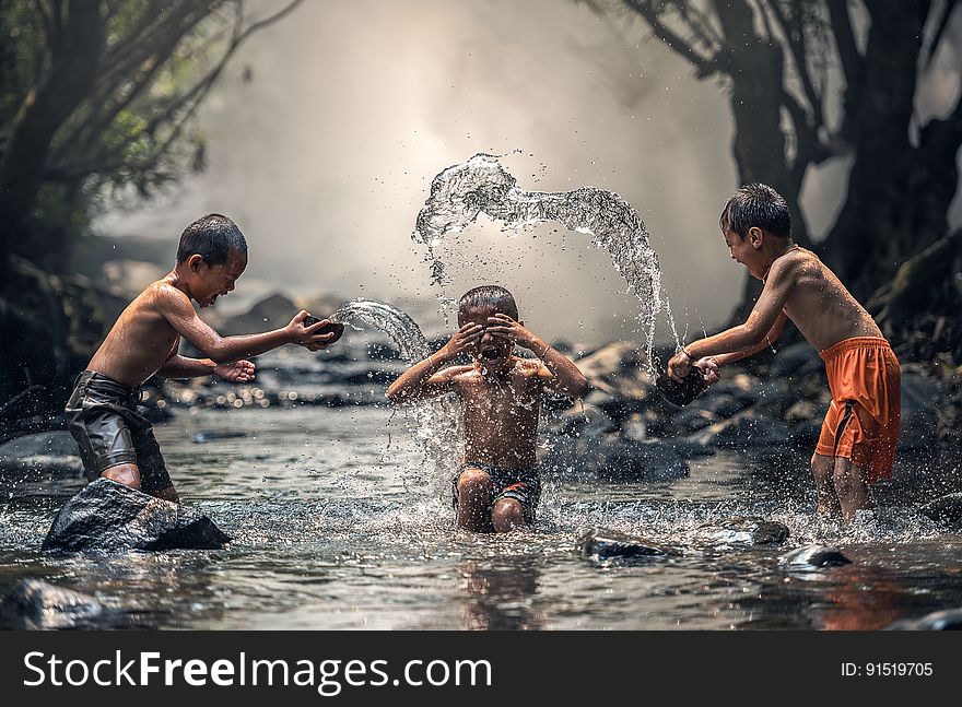 Group of People Splashing Water