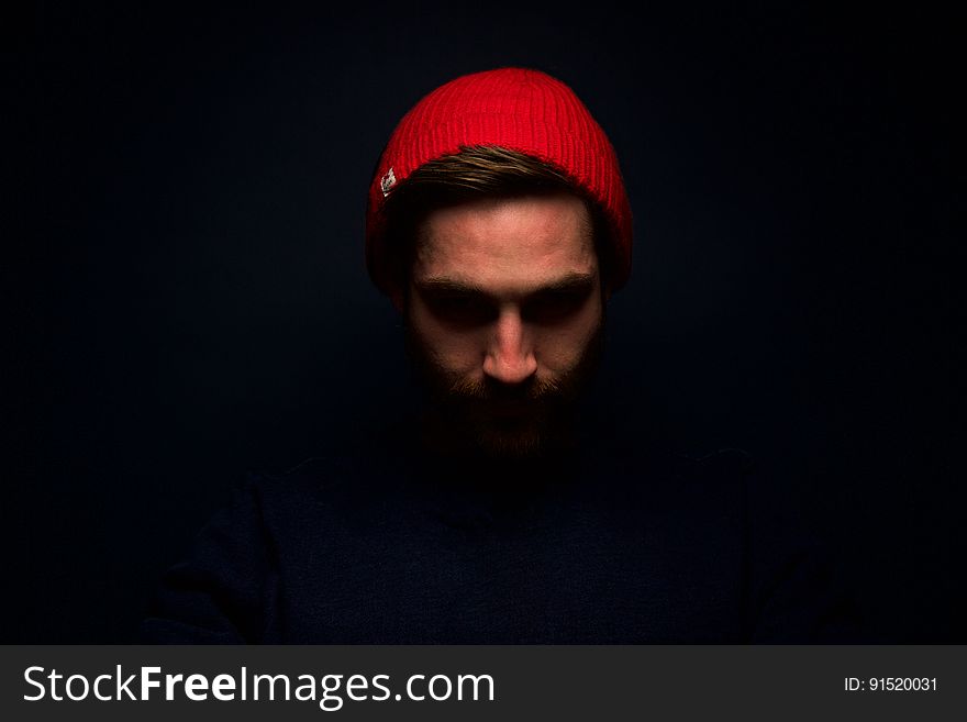 Portrait Of Man In Red Hat