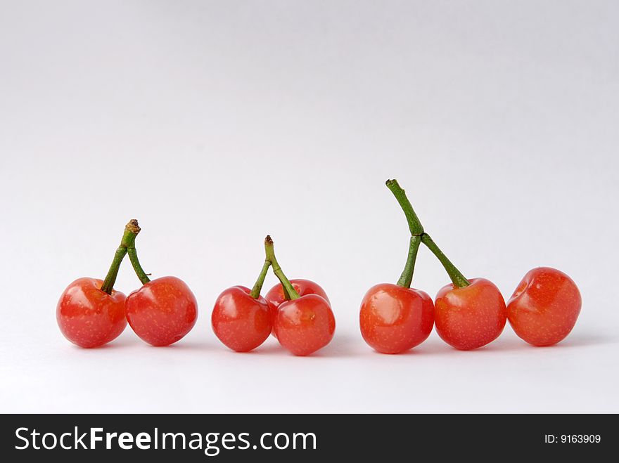 Cherries are in a line,and the branchs look like chinese character.