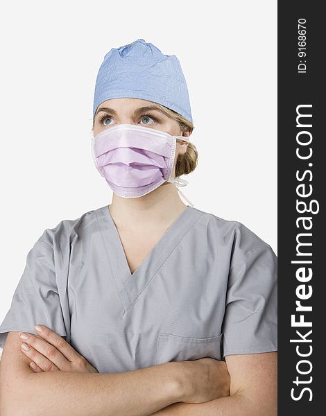 Female surgeon dressed in scrubs prepared for work. Female surgeon dressed in scrubs prepared for work