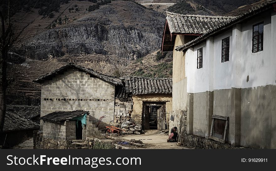Exterior of stone and brick homes in hills of abandoned village on sunny day. Exterior of stone and brick homes in hills of abandoned village on sunny day.
