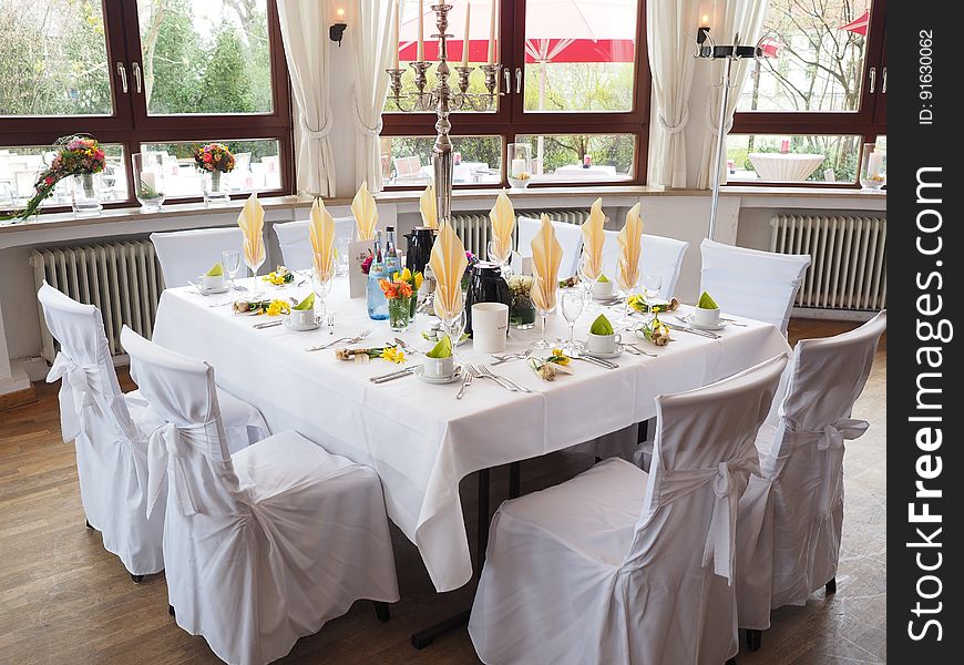 An elegantly set table in a restaurant. An elegantly set table in a restaurant.