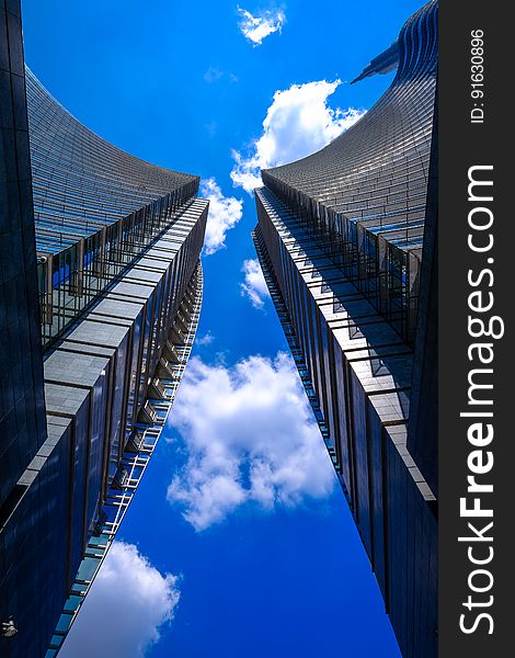 A low angle view of a pair of high-rise buildings. A low angle view of a pair of high-rise buildings.