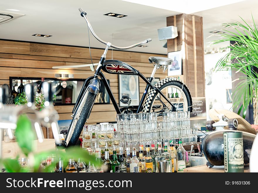 Black Cruiser Bicycle on Bar Table