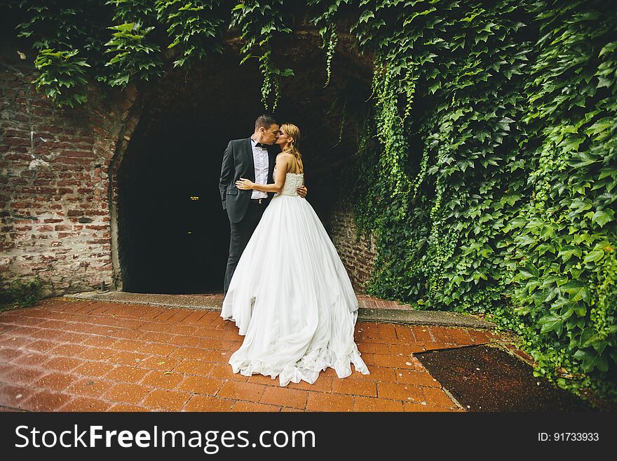 Young newlywed couple at outdoors ceremony. Young newlywed couple at outdoors ceremony