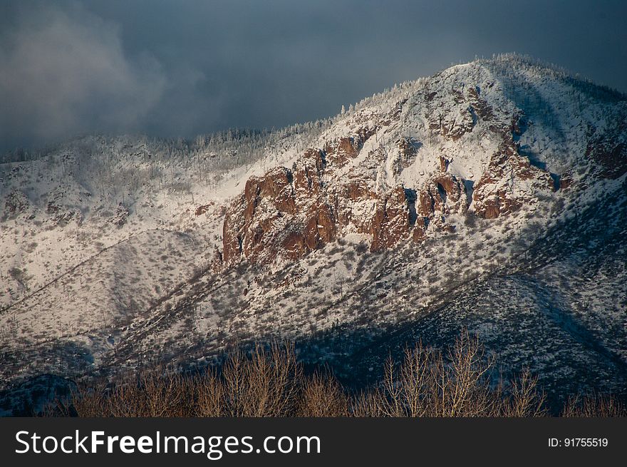 Morning light on Little Elden as a winter storm clears and the clouds begin to break. Little Elden is a peak on the northern side of Mount Elden. Winter storms passed through northern Arizona the first week of January 2016, dropping nearly three feet of snow in some areas around Flagstaff, Arizona. Photo by Deborah Lee Soltesz, January 8, 2016. Source: U.S. Forest Service, Coconino National Forest. Learn more about the Coconino National Forest.