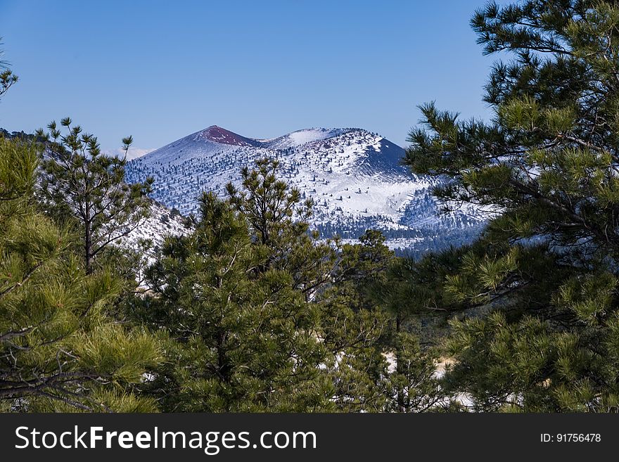 A winter storm December 24, 2016 brough a white Christmas across the state, with several inches to a foot falling around the Flagstaff, Arizona area. View of Sunset Crater Volcano from northeast of the San Francisco Peaks, hiking on FR 9125 into an unnamed crater. Photo by Deborah Lee Soltesz, December 25, 2016. Credit: Coconino National Forest, U.S. Forest Service.