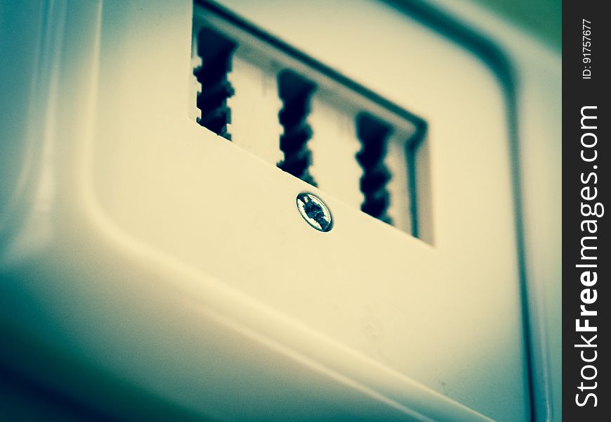 A close up of a white plastic socket. A close up of a white plastic socket.