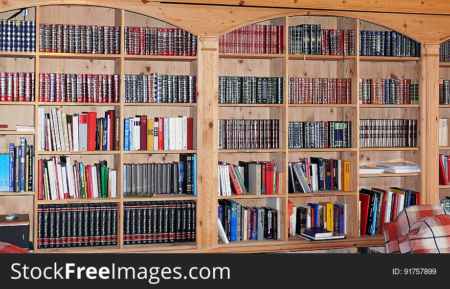 A background of books on the shelves in a library. A background of books on the shelves in a library.