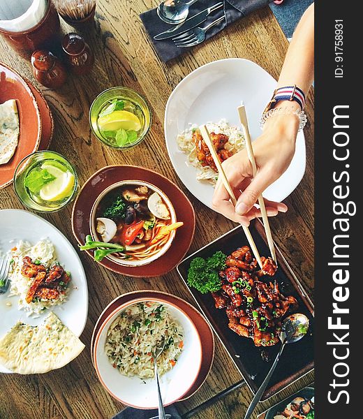 Person Eating Using Chopsticks