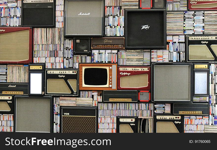 A background of guitar amplifiers, cds, LP albums and video tapes. A background of guitar amplifiers, cds, LP albums and video tapes.