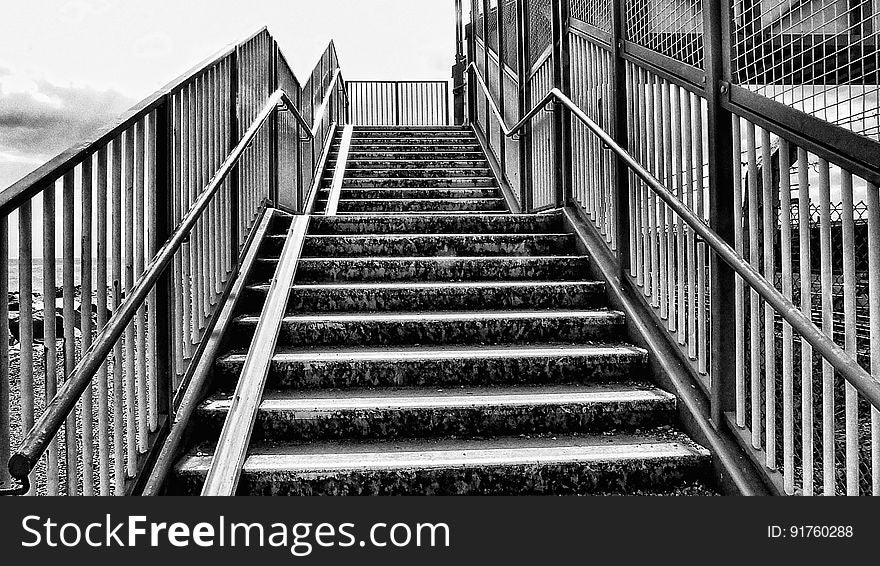 Black and white stairs leading up to a platform.