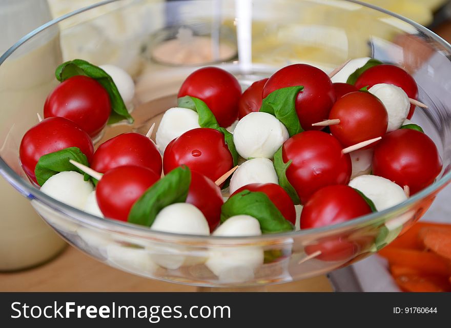 Red Round Fruit Served on Clear Glass Bowl