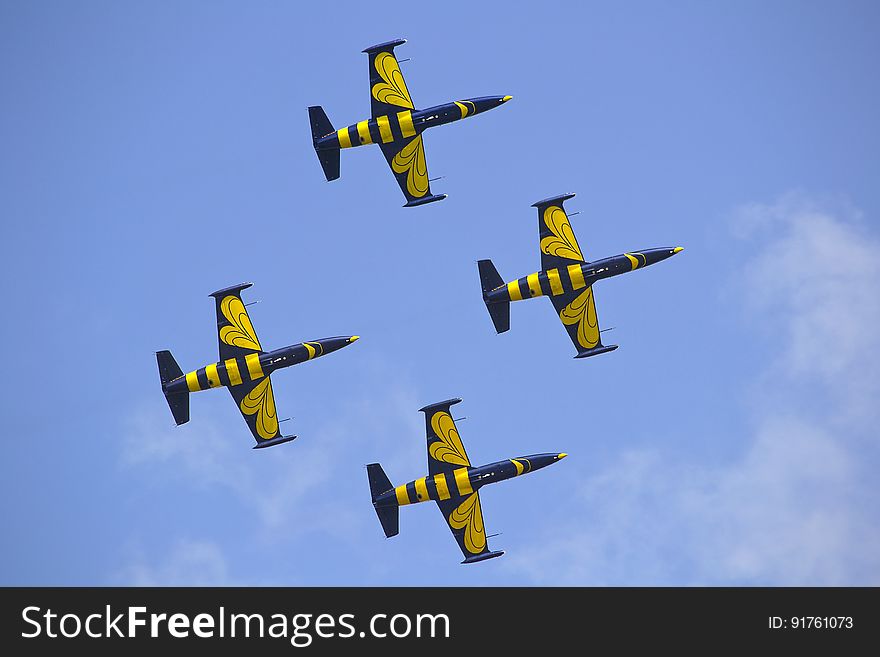 Yellow And Black Air Craft During Blue Sky