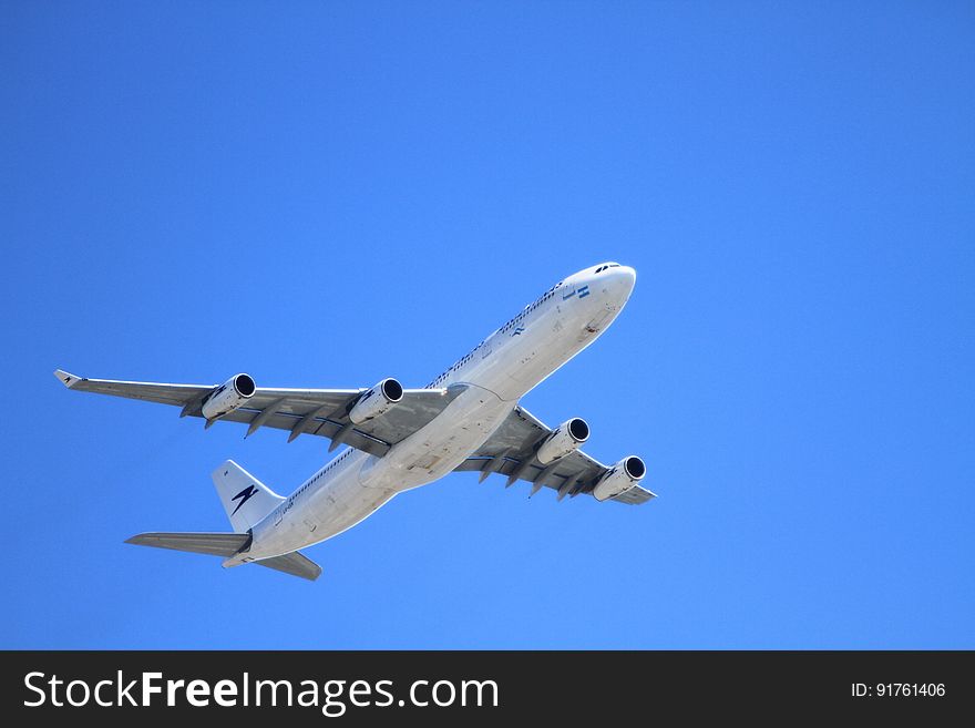 White Passenger Plane Flying on Sky during Day Time