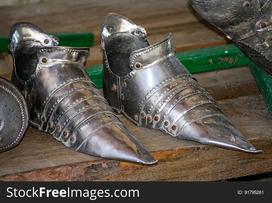 The iron shoes of the knight on the stand