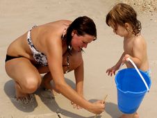 Mother And Child Playing Together At Beach Stock Images Mother And Child Playing Together At Beach Stock Images