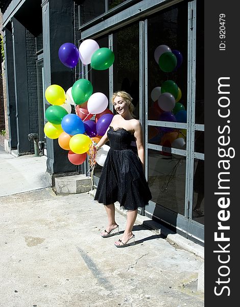 Young blond woman with balloons