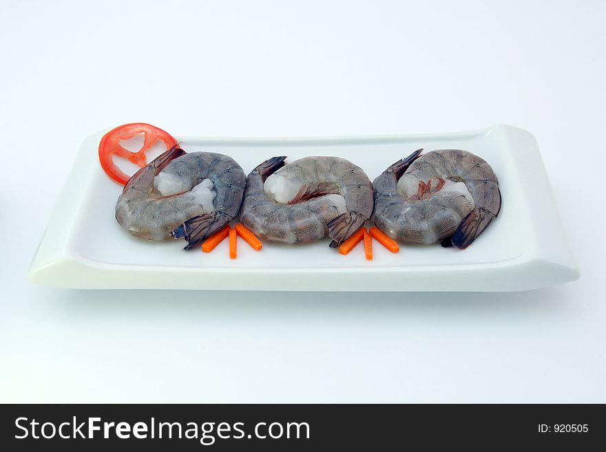 Chinese food - Gourmet raw sushi king tiger prawns on white