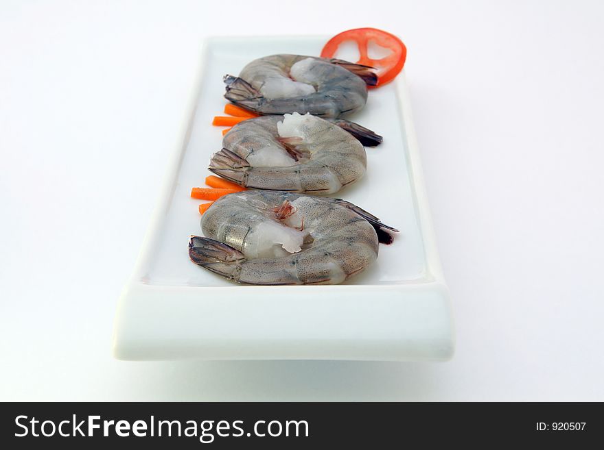 Chinese food - Gourmet raw sushi king tiger prawns on white