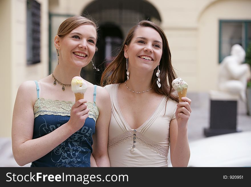 Sisters eating ice-cream. Sisters eating ice-cream