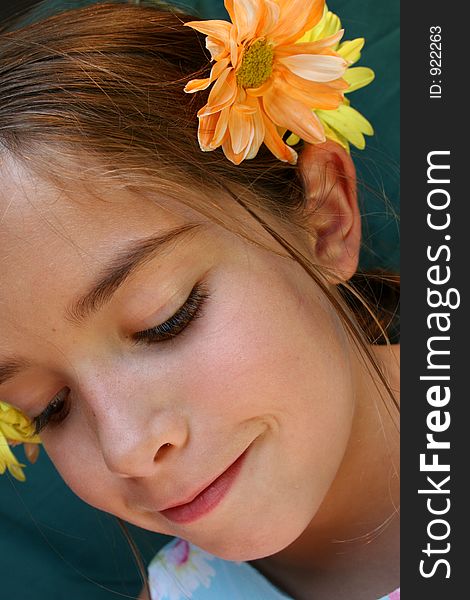 Young beautiful girl with Flowers in her hair